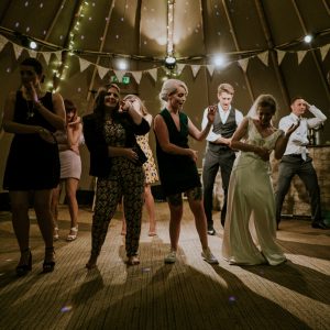 group dancing in tipi